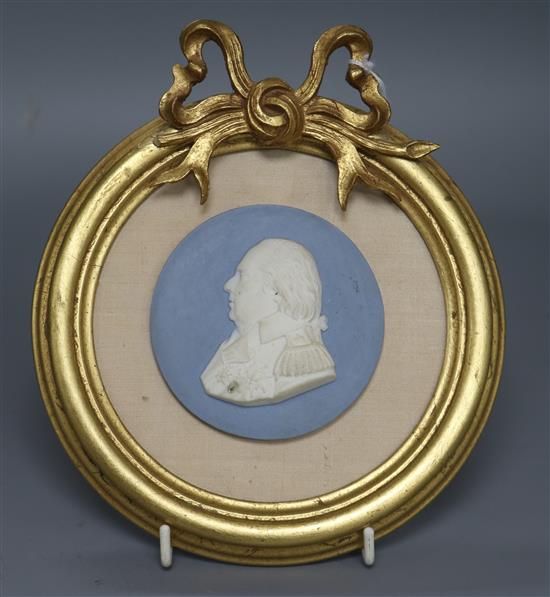 A Sevres blue ground biscuit medallion of Louis XVI diameter 8cm